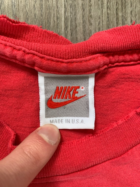 red nike tag