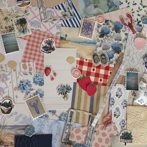 May include: A collection of decorative paper scraps, stickers, and ephemera featuring nautical, floral, and fruit themes. Visible items include images of lighthouses, lobsters, oysters, seashells, strawberries, blue hydrangeas, and postage stamps.