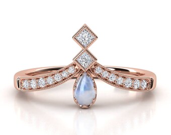 Moonstone ring. Moonstone and diamond engagement ring. Diamond ring. Pear shape moonstone and princess diamond.