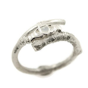 Contemporary claddagh ring with natural branch band.