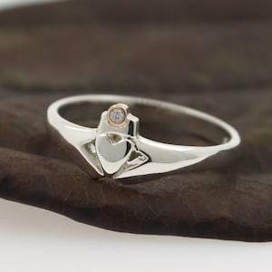 Claddagh ring, with real diamond set in a rose gold bezel crown. Diamond ring.