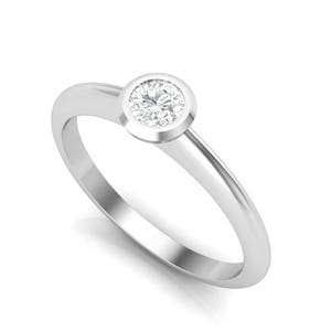 Diamond ring. Engagement ring. Platinum solitaire diamond ring. Dainty modern minimal ring.