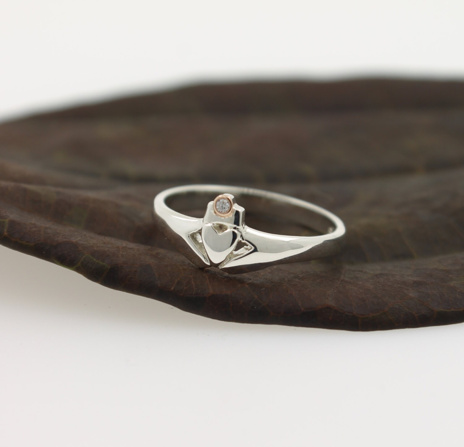 Claddagh ring, with real diamond set in a rose gold bezel crown. Diamond ring.