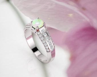 Opal ring. Engagement ring. Diamond and opal ring. Available in 14K, 18K yellow, white and rose gold also in platinum.