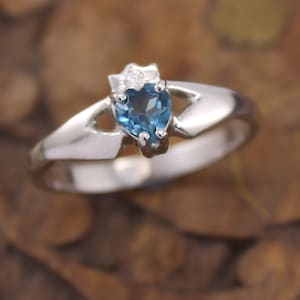 Real Blue Topaz and diamond contemporary Claddagh Ring. 9K ,14K, 18K, Platinum or Sterling silver ladies authentic Irish Claddagh .