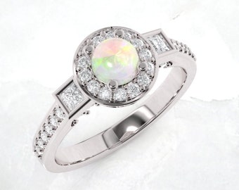 Opal engagement ring. Engagement ring. Diamond and opal ring. Available in 14K, 18K yellow, white and rose gold also in platinum.