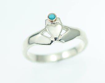 Claddagh ring,  with real turquoise set in a rose gold bezel crown. Irish claddagh ring.