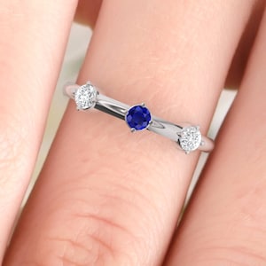 Wedding ring. Sapphire and Diamond ring. Eternity ring. Three diamonds available in 14K/18K white, yellow or rose gold. Also platinum.