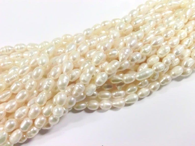 10 30 freshwater pearls cultured pearls white cream oval baroque approx: 6-7.5x5-6 mm pearls 2k image 2