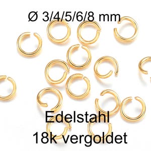Könnte beinhalten: Eine Sammlung goldfarbener Metall-Biegeringe mit einer Öffnung. Der Text Ø 3/4/5/6/8 mm, Edelstahl und 18k vergoldet ist sichtbar. Diese kreisförmigen Schmuckverbinder sind in einem verstreuten Muster angeordnet und haben eine metallische Oberfläche.