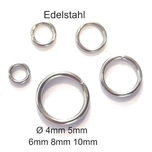 Op de afbeelding: Een verzameling roestvrijstalen sprongringen in verschillende maten, variërend van 4 mm tot 10 mm in diameter. De ringen worden weergegeven op een witte achtergrond, met het woord "Edelstahl" erboven.