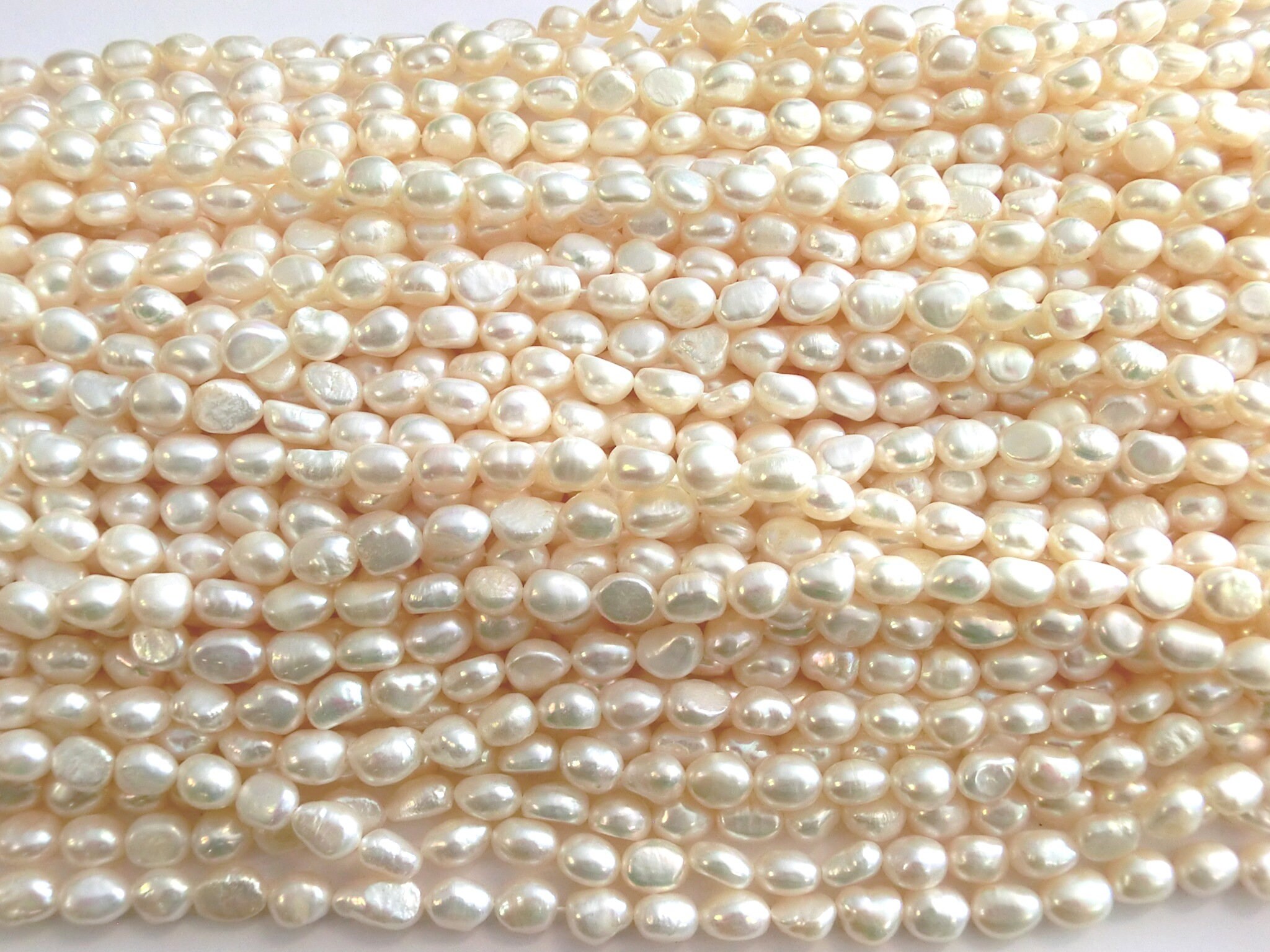 Freshwater pearls cultured pearls white cream oval baroque 5-6x8-8.5 …