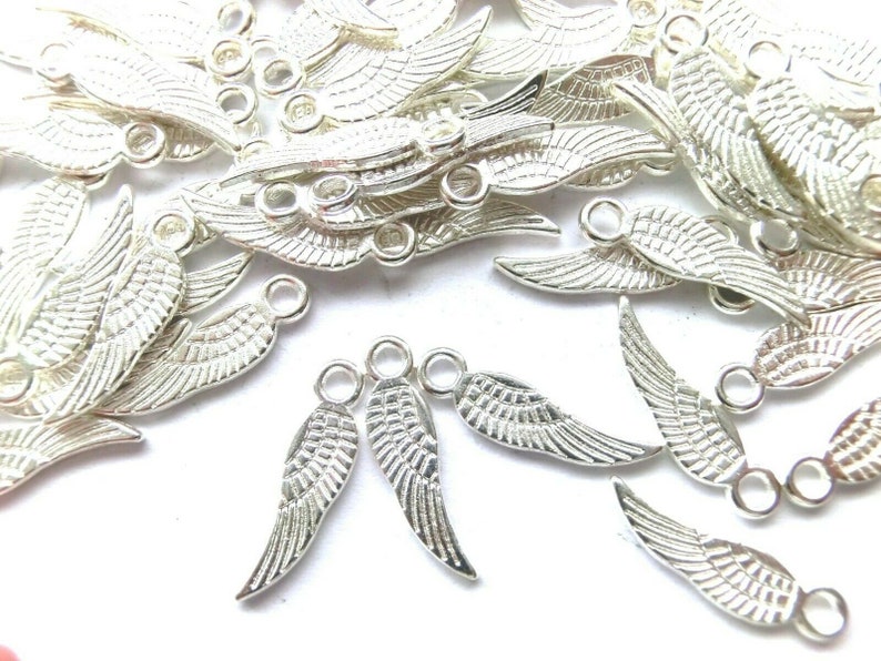 100 WINGS pendant angel wings 17 x 5 mm charms color choice silver antique silver gold and bronze angel spacer lucky charm metal Silber #S104