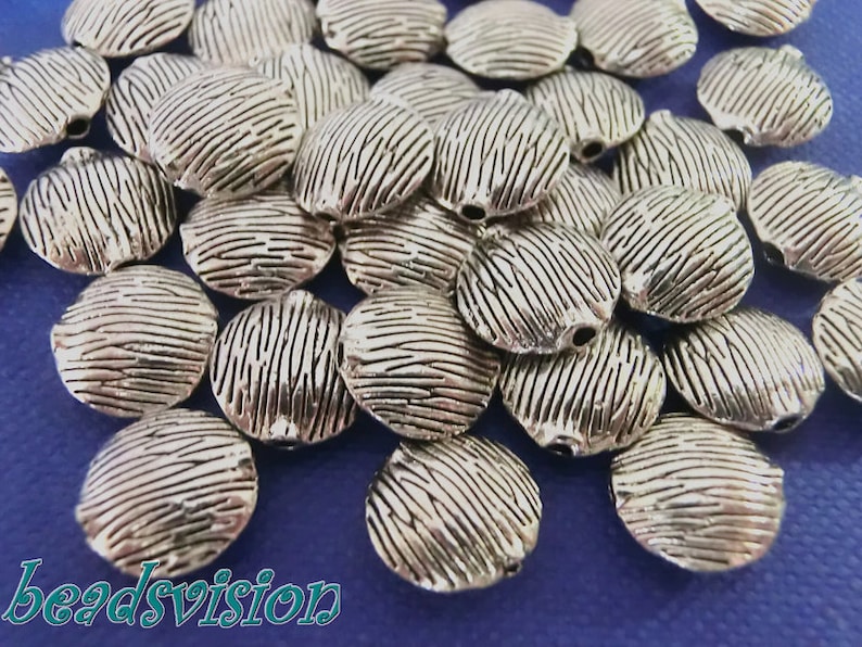 104080 Spacer 10 mm coin metal beads between pearl color antique silver #S472