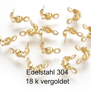 Könnte beinhalten: Goldfarbene Metallverschlüsse zum Schmuckbasteln. Die Verschlüsse sind aus Edelstahl mit einer 18 Karat Vergoldung. Der Text "Edelstahl 304 18 k vergoldet" ist im Bild sichtbar.