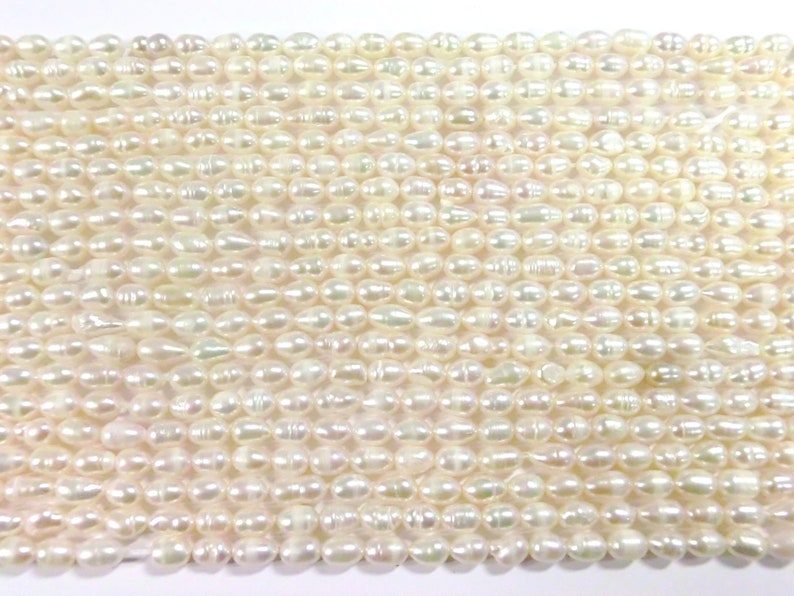 10 30 freshwater pearls cultured pearls white cream oval baroque approx: 6-7.5x5-6 mm pearls 2k image 1