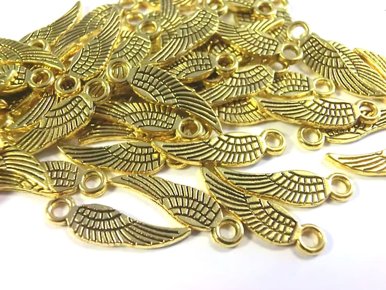 100 WINGS pendant angel wings 17 x 5 mm charms color choice silver antique silver gold and bronze angel spacer lucky charm metal Gold #S592