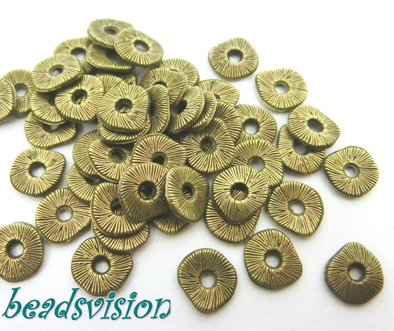 50 / 100 wavy spacer metal beads 8 mm metal color bronze S469 image 1