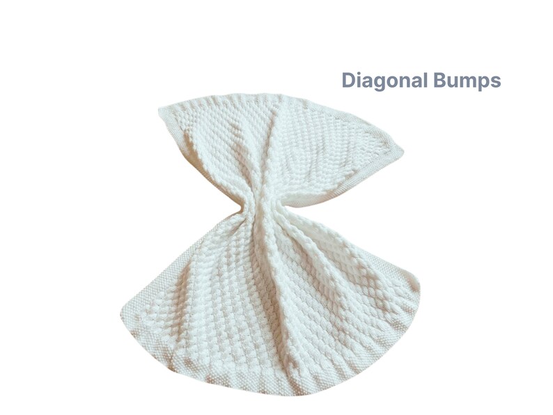 White knitted baby blanket with a diagonal bump pattern.