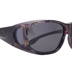 May include: Purple and black patterned sunglasses with a side shield and gray lenses. The sunglasses have "UV400 POLARIZED" printed on the right lens.
