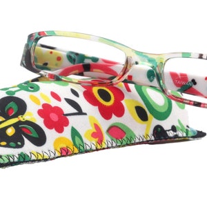 May include: Reading glasses with a vibrant floral design and a matching case. The glasses have a rectangular frame, and the case features a butterfly and flower pattern. The text "TAIWAN" is visible on the glasses.