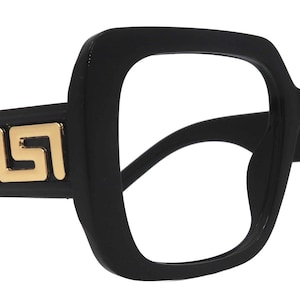 May include: Black square-framed eyeglasses with gold-colored decorative accents on the temples. The glasses have a thick frame and a bold, modern design. The lenses are clear.