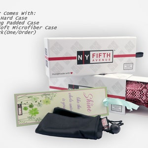 May include: White boxes with the text "NY FIFTH AVENUE" and red accents. The boxes contain a drawer hard case, a matching padded case, a black microfiber case, and a bookmark. The text "Each Pair Comes With:" is visible.