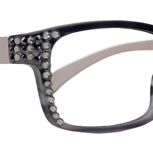 May include: Gray eyeglasses with rhinestones on the temples and a light gray frame.