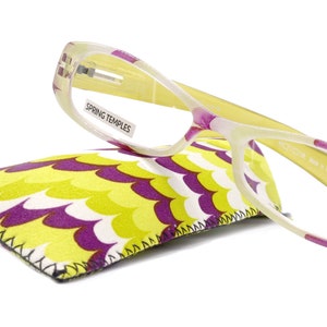May include: Yellow and purple reading glasses with spring hinges and a +2.75 strength. The glasses come with a yellow and purple patterned case.