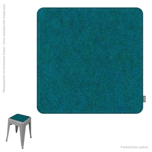 May include: A teal square cushion with rounded corners and a stitched border. The cushion is shown next to a small metal stool with a matching teal seat cushion. The color is described as petrol.