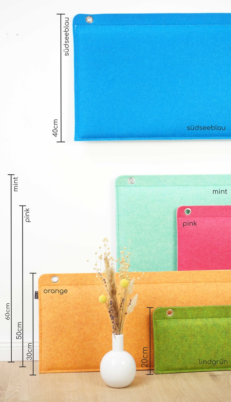 K&ouml;nnte beinhalten: Eine Auswahl an Filz-Organizern in verschiedenen Farben. Das gr&ouml;&szlig;te ist orange, 60 cm hoch, und das kleinste ist gr&uuml;n, 20 cm hoch. Weitere Farben sind Blau, Mint und Pink. Jeder Organizer hat eine Metall&ouml;se und gen&auml;hte Kanten.