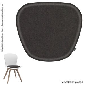 May include: A dark gray chair cushion with a stitched edge. The cushion is made of felt and has a label that says "feltd."