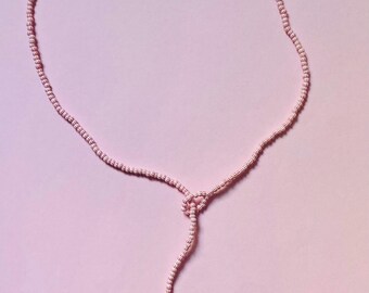 Cordón de cuentas con cierre de bucle