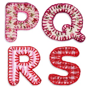 May include: Four fabric letters, P, Q, R, and S, are stitched together with pink and red thread. The letters are decorated with floral and striped patterns.