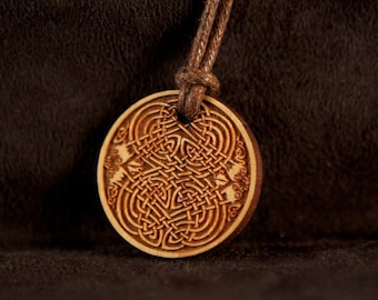 Celtic Art Pendant Etched in Cherry Wood from The Book of Kells, made in Ireland.