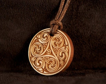 Celtic Art Spiral Pendant, Etched in Cherry Wood from The Book of Kells, made in Ireland.