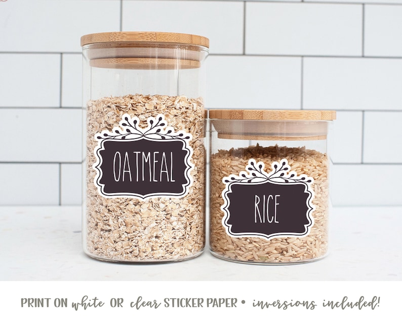 May include: Two glass jars with bamboo lids, filled with oatmeal and rice.  The jars have black and white labels with the words "Oatmeal" and "Rice" printed on them.