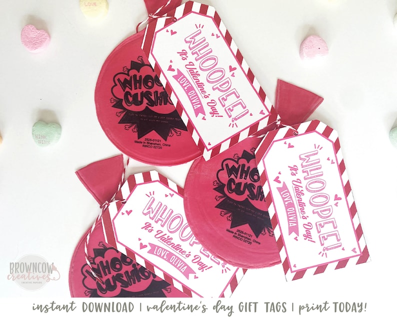 May include: Red and white Valentine's Day gift tags with the text "WHOOPEE! It's Valentine's Day!" and "LOVE OLIVIA". The tags are attached to red and white striped candy bags with the text "WHO CUSH".