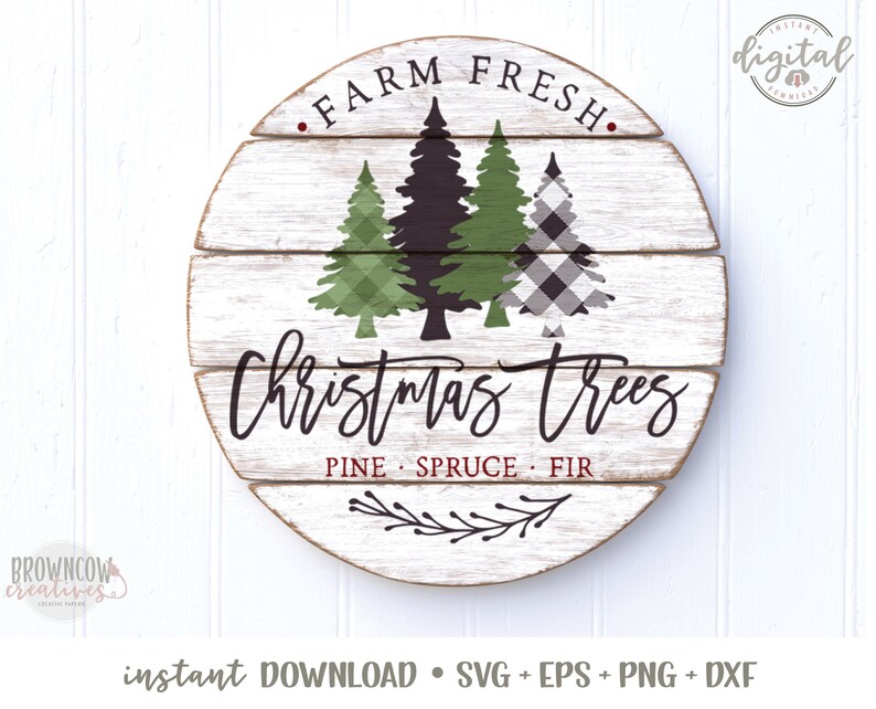 May include: A round wooden sign with a white background and black lettering. The sign says "Farm Fresh Christmas Trees" with the words "Pine Spruce Fir" underneath. There are three stylised Christmas trees in green and black and white plaid.