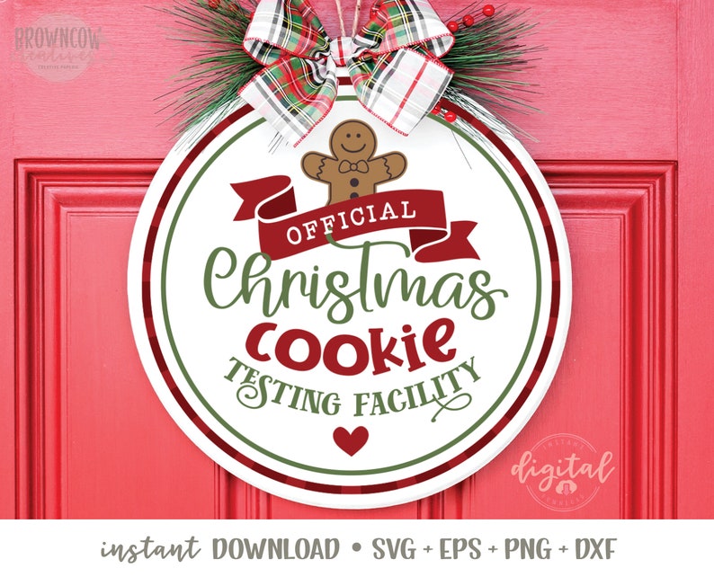 May include: A white round sign with green and red accents. The sign says "Official Christmas Cookie Testing Facility" with a gingerbread man graphic and a red ribbon.