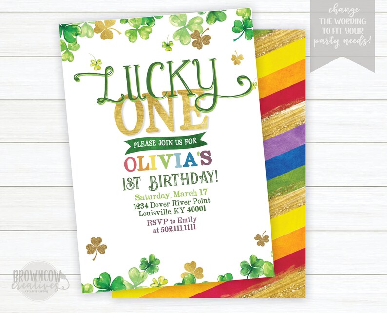 May include: A white invitation with green shamrocks and gold glitter. The text reads "Lucky One" in gold glitter letters. The invitation is for Olivia's 1st birthday party. The party is on Saturday, March 17th at 1234 Dover River Point, Louisville, KY 40001. RSVP to Emily at 502.111.1111.