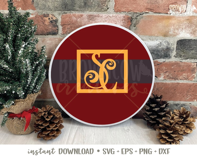 May include: A round, red and white, decorative sign with a gold monogram of the letter "S" in a square frame. The sign is on a brick background.