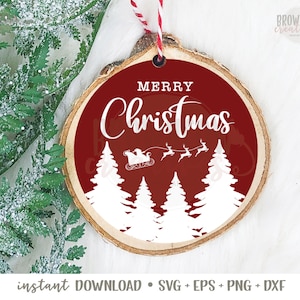 May include: A round wooden bauble with a red background and white text that says "Merry Christmas". The bauble features a silhouette of a sleigh with Santa Claus and reindeer flying over a forest of white pine trees.