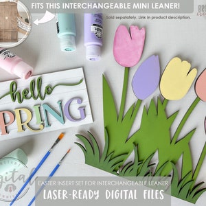 May include: Laser-cut wood craft project featuring a spring-themed sign with the words "hello spring" and a bouquet of colorful tulips. The project includes digital files for laser cutting.
