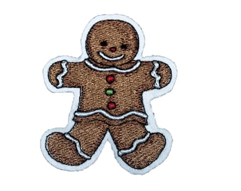 May include: A gingerbread man embroidered patch with white icing and red and green candy details.