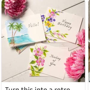 May include: Three white greeting cards with watercolor illustrations. One card features palm trees and the text Hello!, another shows colorful flowers and Happy Birthday, and the third displays pink hibiscus flowers and Thinking of You.