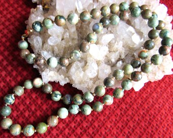 Necklace gemstone ryolite, olive green, browns, creams, 8mm rounds with 2mm 12k goldfilled beads and some hand knotting, , length 25 inch.