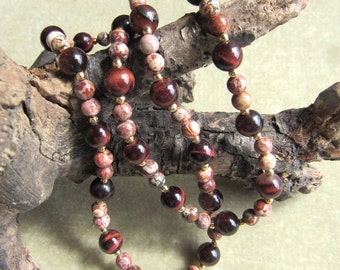 Necklace combining leopard jasper and red tigereye, 4mm and 6mm stones, length is 16 inches, 12k gold filled beads,spring ring clasp.