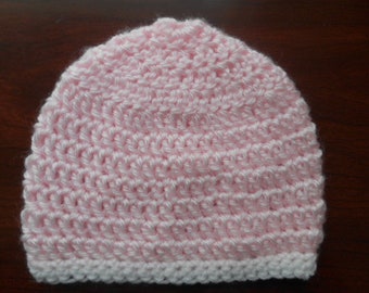 This soft pink hand crocheted baby hat has white crochet trim and will keep your baby warm and accent that precious out fit.  Size 0-3 mos.