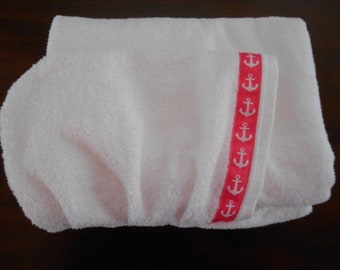 Hooded towel is white with nautical pink anchor trim. 30" x 52"  Great for baby shower gift, birthday gift or hooded beach towel.